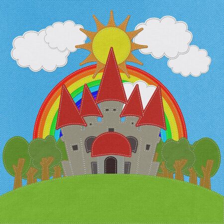 Fairy-tale castle on a green field with stitch style on fabric backgroundの写真素材