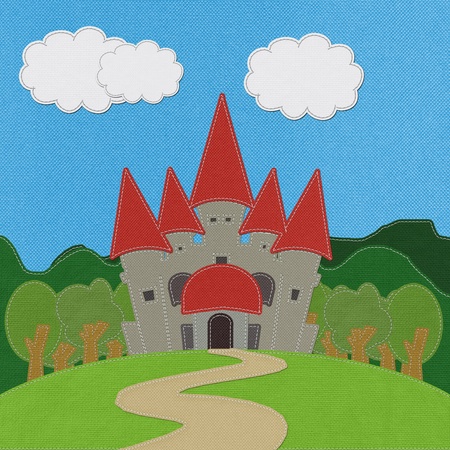 Fairy-tale castle on a green field with stitch style on fabric backgroundの写真素材