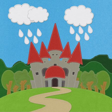 Fairy-tale castle on a green field with stitch style on fabric backgroundの写真素材