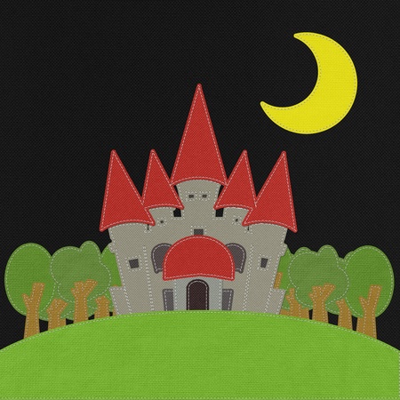 Fairy-tale castle on a green field with stitch style on fabric backgroundの写真素材