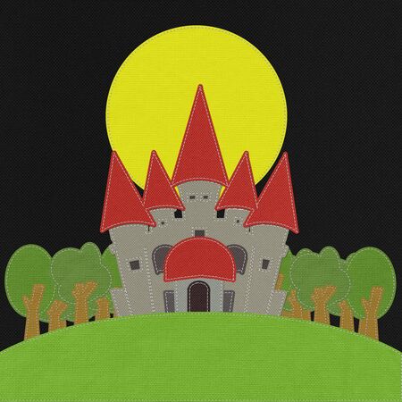 Fairy-tale castle on a green field with stitch style on fabric backgroundの写真素材