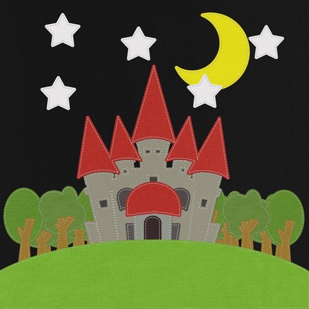 Fairy-tale castle on a green field with stitch style on fabric backgroundの写真素材