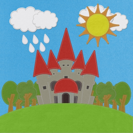 Fairy-tale castle on a green field with stitch style on fabric backgroundの写真素材