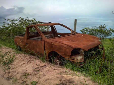 Abandoned broken car on the roadの写真素材