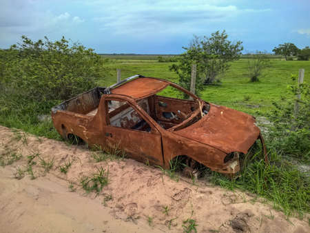 Abandoned broken car on the roadの写真素材