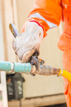 Worker man fix water system valveの写真素材