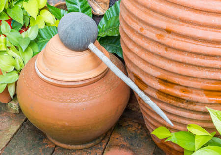 Water Dipper made from coconut shell and Clay potの写真素材