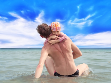 Happy fatherhood in the beachの写真素材