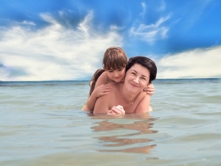 Happy family on the beachの写真素材