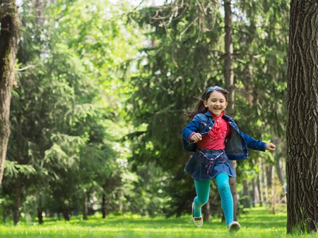 Happy girl at summer meadowの写真素材