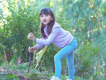 Young girl walking at the forrestの写真素材