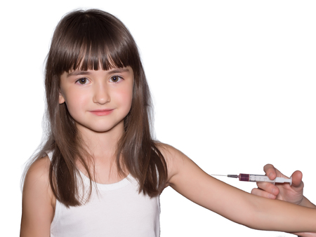 Injection of vaccine for girl isolatedの写真素材