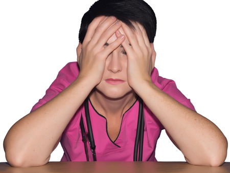 Tired doctor with stethoscope isolatedの写真素材