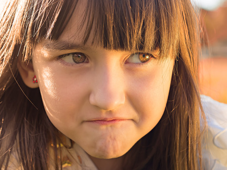 Portrait of emotional little girlの写真素材