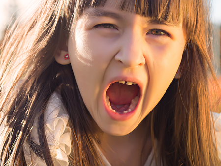 Portrait of emotional little girlの写真素材