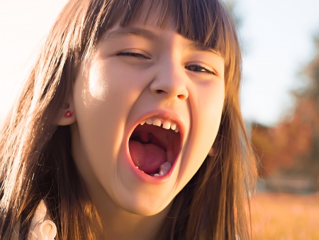 Portrait of emotional little girlの写真素材