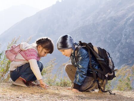 Portrait of hiking caucasian boy and girlの写真素材