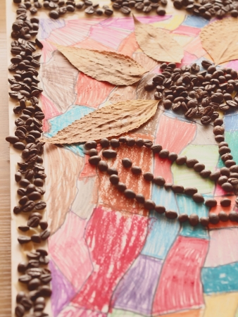 Children craft with coffee beans in shape of flower
