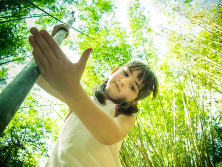 Caucasian child girl walking at the wild jungeの写真素材