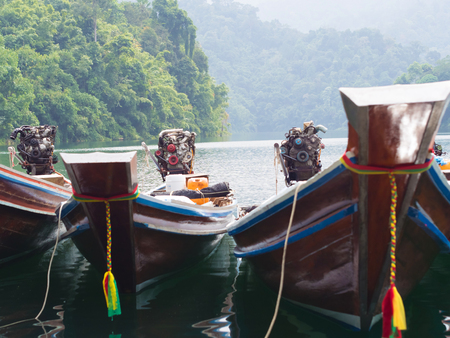 Longtail boats at the pier in Thai, Cheow Lan Lake, Khao Sok Nationalの写真素材