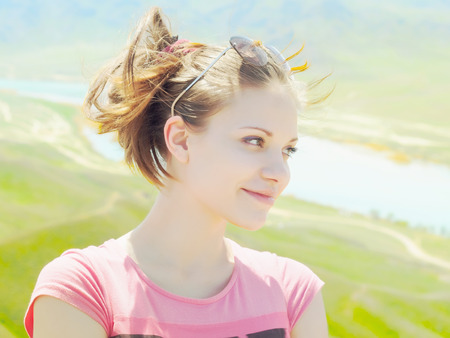 Portrait of young caucasian beautiful  women in summer nature on the background of riverの写真素材