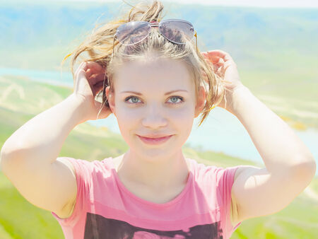 Portrait of young caucasian beautiful  women in summer nature on the background of riverの写真素材