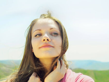 Face of young caucasian beautiful  women in summer natureの写真素材