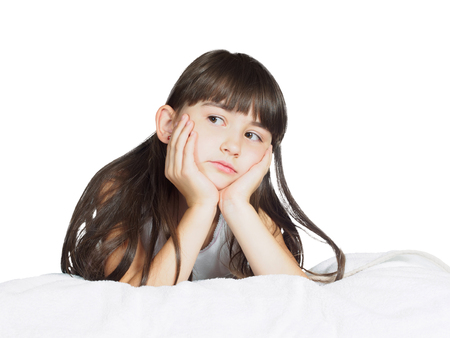 Portrait of caucasian  sad girl child kid isolated on white backgroundの写真素材