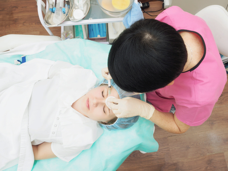 Cosmetology procedure mesoteraphy. Rejuvenation revitalization, skin nutrition, wrinkle reduction. Doctor making microneedle procedure.の写真素材