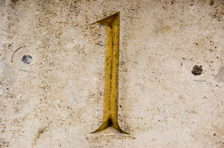 Number one carved and painted on the outside of an historic office block in the City of London    Outside wall, viewed from public pavement の写真素材