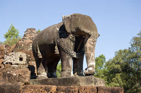 One of the huge elephant statues guarding the corners of the ancient Khmer temple of East Mebon   Part of the Angkor  complex in Siem Reap, Cambodia  Ancient Khmer sculpture, over 1000 years old の写真素材