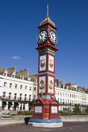 The landmark Jubilee Clock overlooking the beach at Weymouth, Dorset  Erected on the Esplanade in 1887 to mark  the 50th year of Queen Victoria s reign の写真素材
