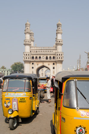 HYDERABAD, ANDHRA PRADESH, INDIA - JANUARY 10  Auto taxis waiting for passengers by the landmark Charminar tower on January 10 2013   The area has been subject to several terrorist attacks のeditorial素材