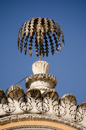 Metal sculpture of a palm tree on the top of an arch at Chowmahalla Palace, Hyderabad, India   Historic home of the Nizams, now open to the public のeditorial素材