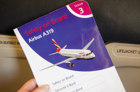London, England - JUNE 4   British Airways passenger safety card on board an Airbus A319, Economy section on June 4 2013   A similar BA plane caught fire weeks earlier のeditorial素材
