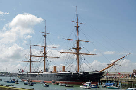 HMS Warrior docked in Portsmouth, Hampshire   The first iron hulled armoured warship in the world and the fastest ship of her time   Now an historic attraction の写真素材