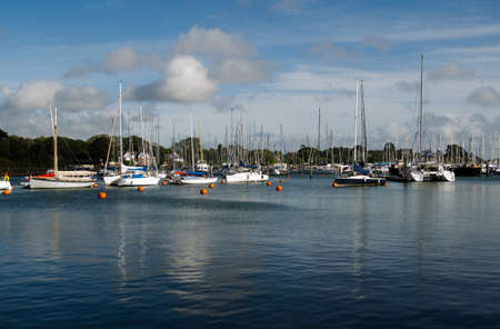 Sailing yachts moored on the Solent at Lymington in the New Forest, Hampshire の写真素材
