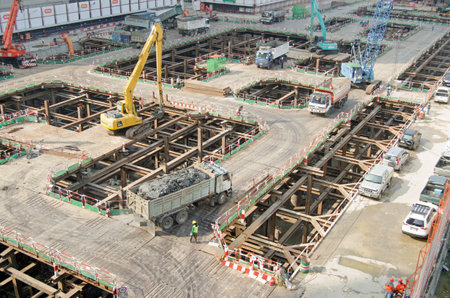 BANGKOK, THAILAND - OCTOBER 26 2013  Construction workers and equipment busy building a new skyscraper in the Sukhumvit district of Bangkok, Thailand のeditorial素材