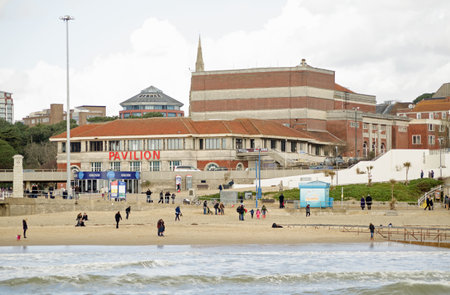BOURNEMOUTH, ENGLAND - March 1, 2014  Holidaymakers enjoying the beach in front of the Pavilion Theatre in Bournemouth, Dorset   のeditorial素材