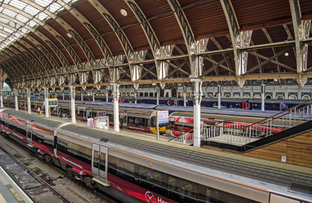 LONDON, UK - MAY 15, 2014   Trains on London s Heathrow Express service waiting at platforms at Paddington Station, West London のeditorial素材
