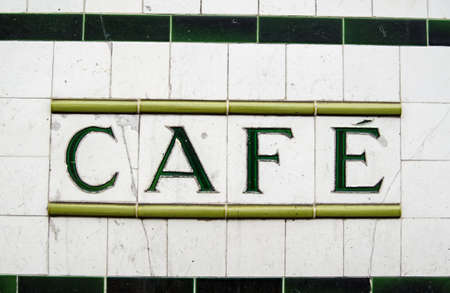 A sign for a cafe made from ceramic tiles outside a former tea shop in North London   Viewed from public pavementの写真素材