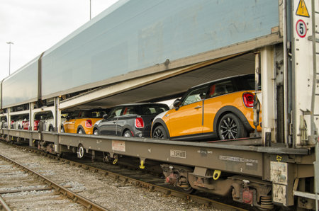 SOUTHAMPTON, UK - MAY 31, 2014  A train full of brand new Mini cars at Southampton about to be exported by ship from the docks   The Mini car is manufactured at BMW  39;s plant in Cowley, Oxfordshire のeditorial素材