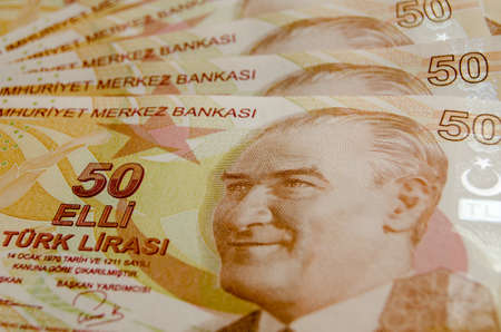 Turkish fifty Lira banknotes laid out in a fan with the face of Mustafa Kemal Ataturk engraved.Used...