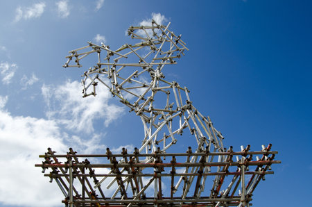 WESTON-SUPER-MARE, UK - AUGUST 26, 2015:  A sculpture of a rearing stallion horse made from recyled scaffolding poles and joints by Ben Long.  On public display at the Somerset seaside resort Weston-Super-Mare.のeditorial素材