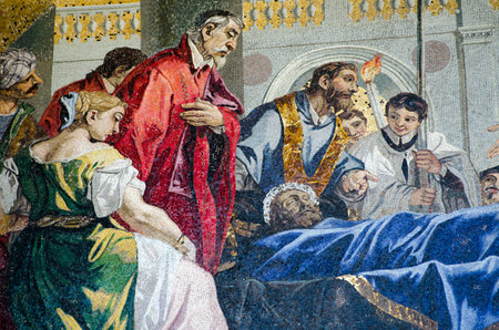 Historic mosaic on the exterior facade of St Mark's Cathedral in Venice showing the death of the city's patron Saint - St Mark.  Mosaic over 100 years old, viewed from public pavement.のeditorial素材