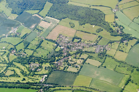 Aerial view of the Kent village of Shoreham on a sunny summer day.  Note the white cross cut into the chalk downs which is a memorial to those killed in World War I.の写真素材
