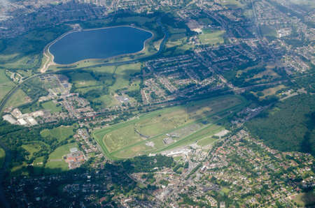 Aerial view of Esher in Surrey with the Sandown Park race course in full view plus the Island Barn...