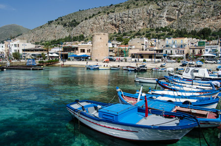 PALERMO, ITALY - JUNE 19, 2018: Fishing boats moored at the resort of Mondello in Palermo, Sicily on a sunny summer morning.のeditorial素材