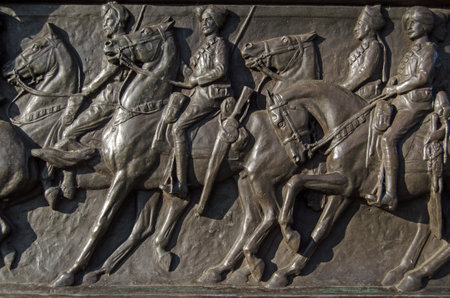 Detail of the bronze frieze of soldiers riding their horses on the Cavalry Monument dedicated to...