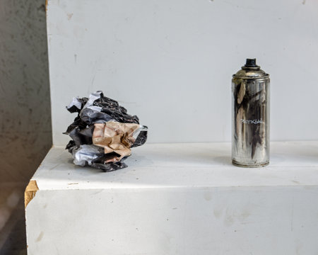 Shop window displaying two pieces by Banksy - a poster of Morrisey screwed up into an angry ball and a tin of spray paint with the label torn off.  Part of the Gross Domestic Product exhibition in a shop window in Croydon, London.のeditorial素材
